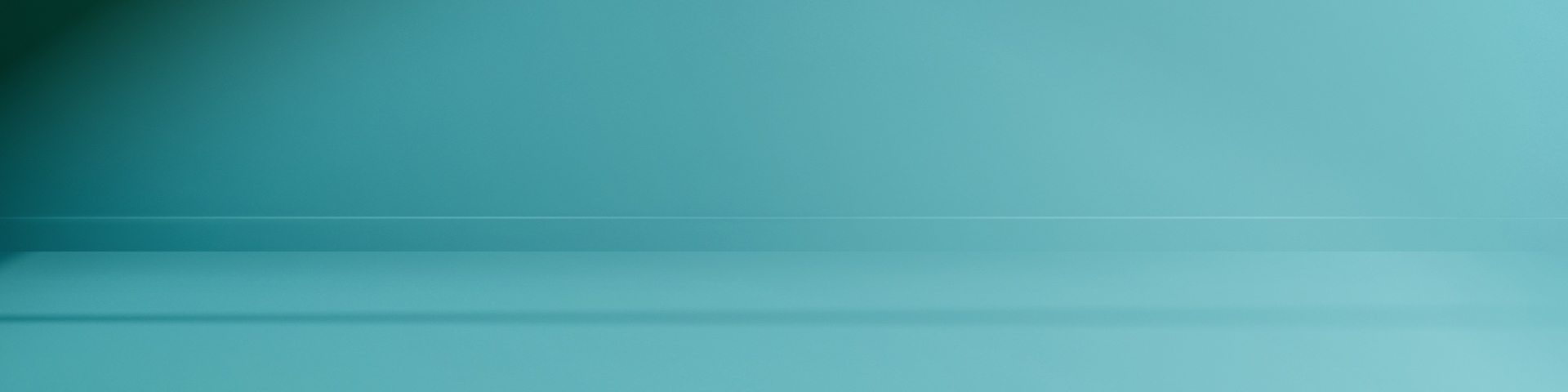 Blank wall in a light blue aqua colour