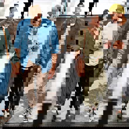 Instant Finance Refer a Friend. Four people walking up stairs