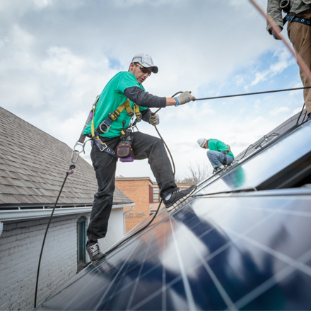 construction crew installing solar panels nz
