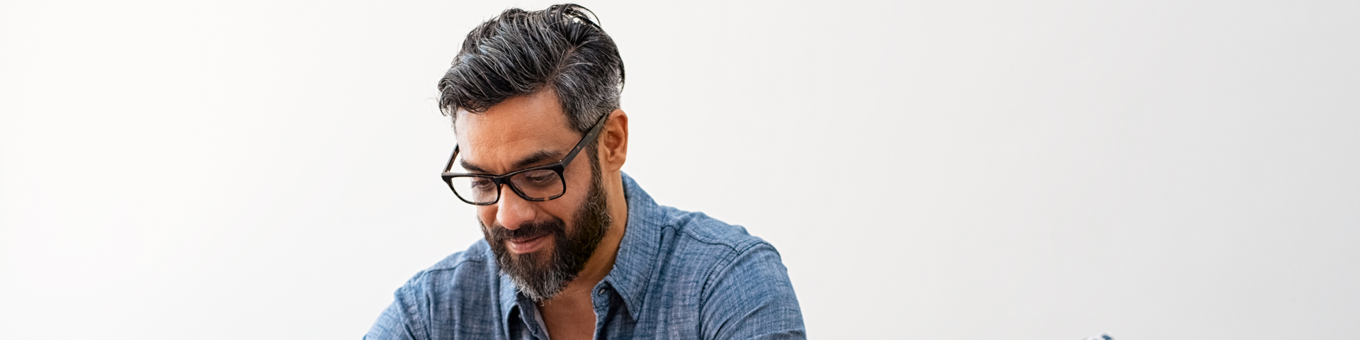 Man on laptop computer looking at his financial health